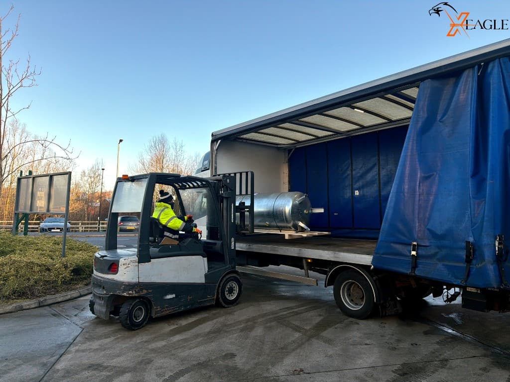 Heavy machinery loaded for dedicated courier delivery