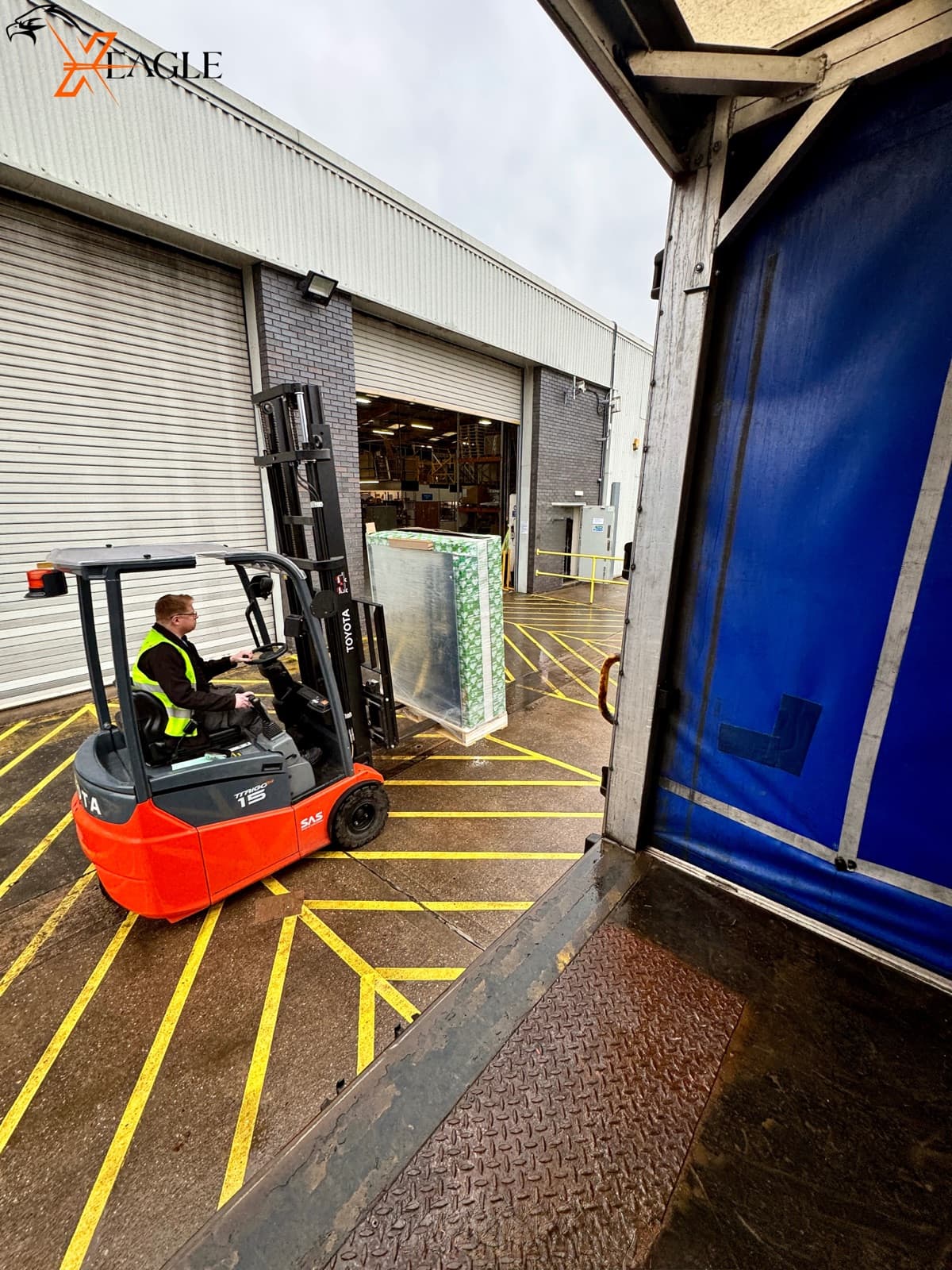 X-Eagle forklift loading pallets at warehouse