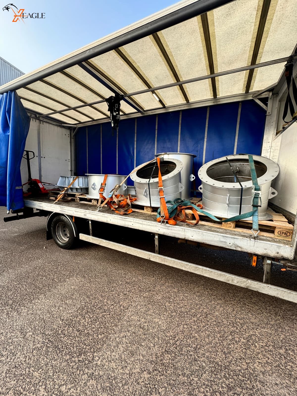 X-Eagle industrial cylinders secured on flatbed truck