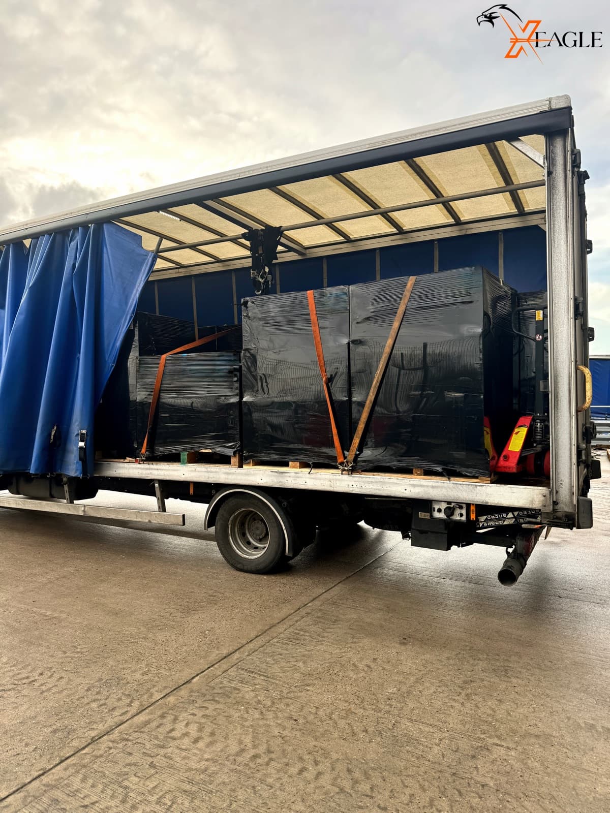 X-Eagle secured heavy cargo with ratchet straps on curtain sider