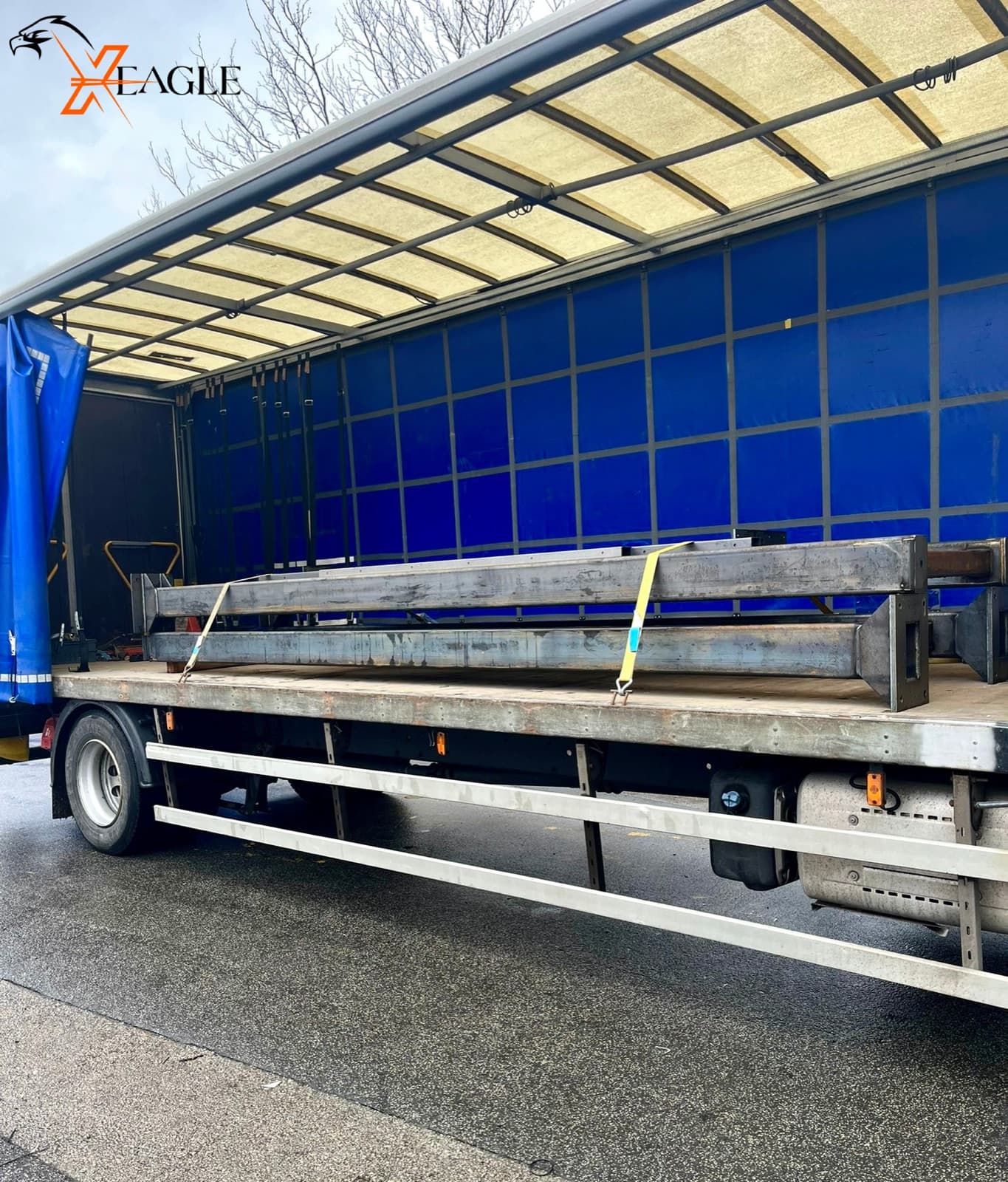 X-Eagle steel beams strapped on curtain sider for delivery